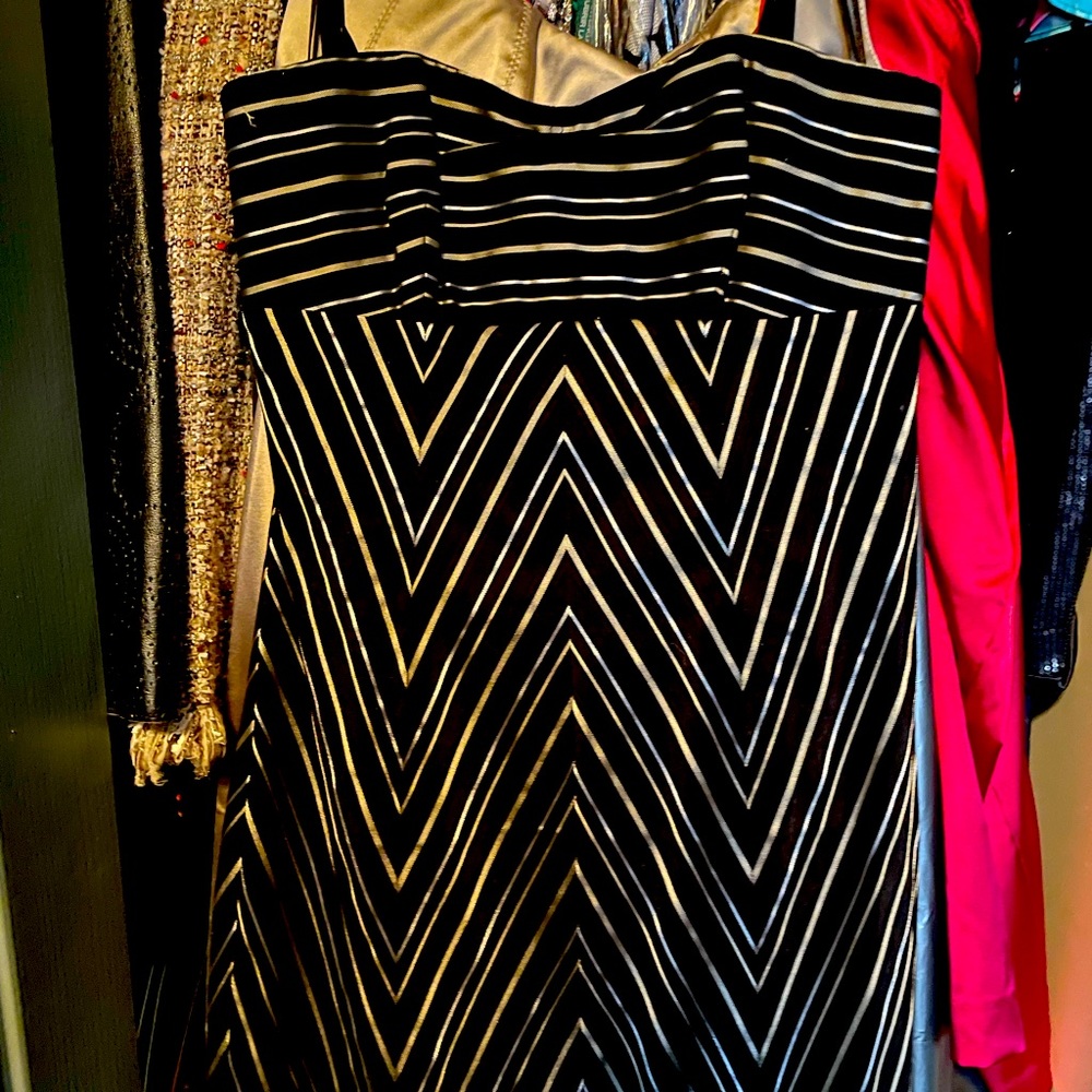Strapless black, gold and silver striped dress with removable straps.